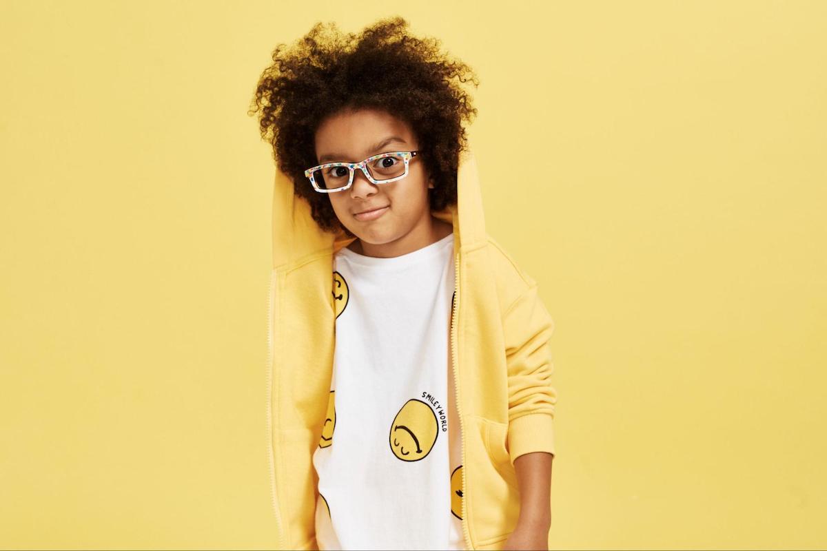 Cartoon characters with glasses: boy wearing a yellow jacket
