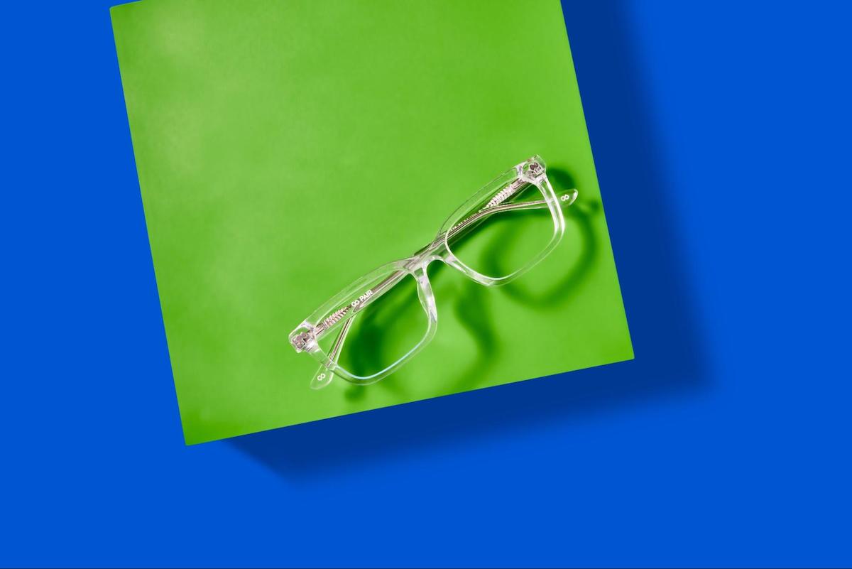 Clear style glasses: eyeglasses on a green and blue background