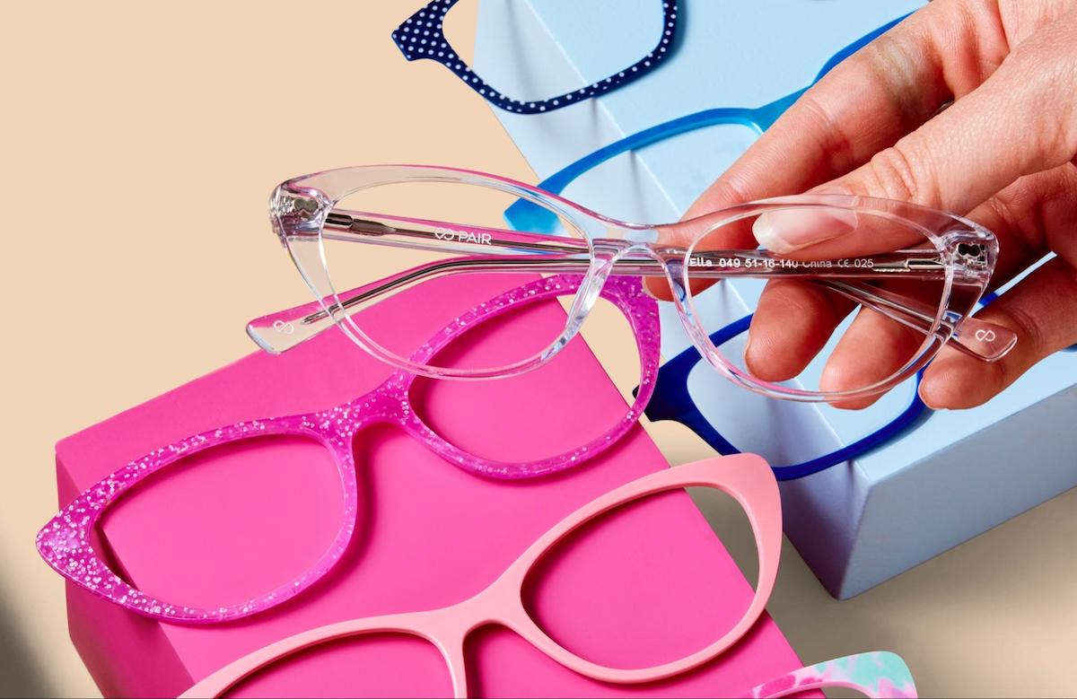 Glasses measurements: person holding Pair Eyewear's eyeglasses