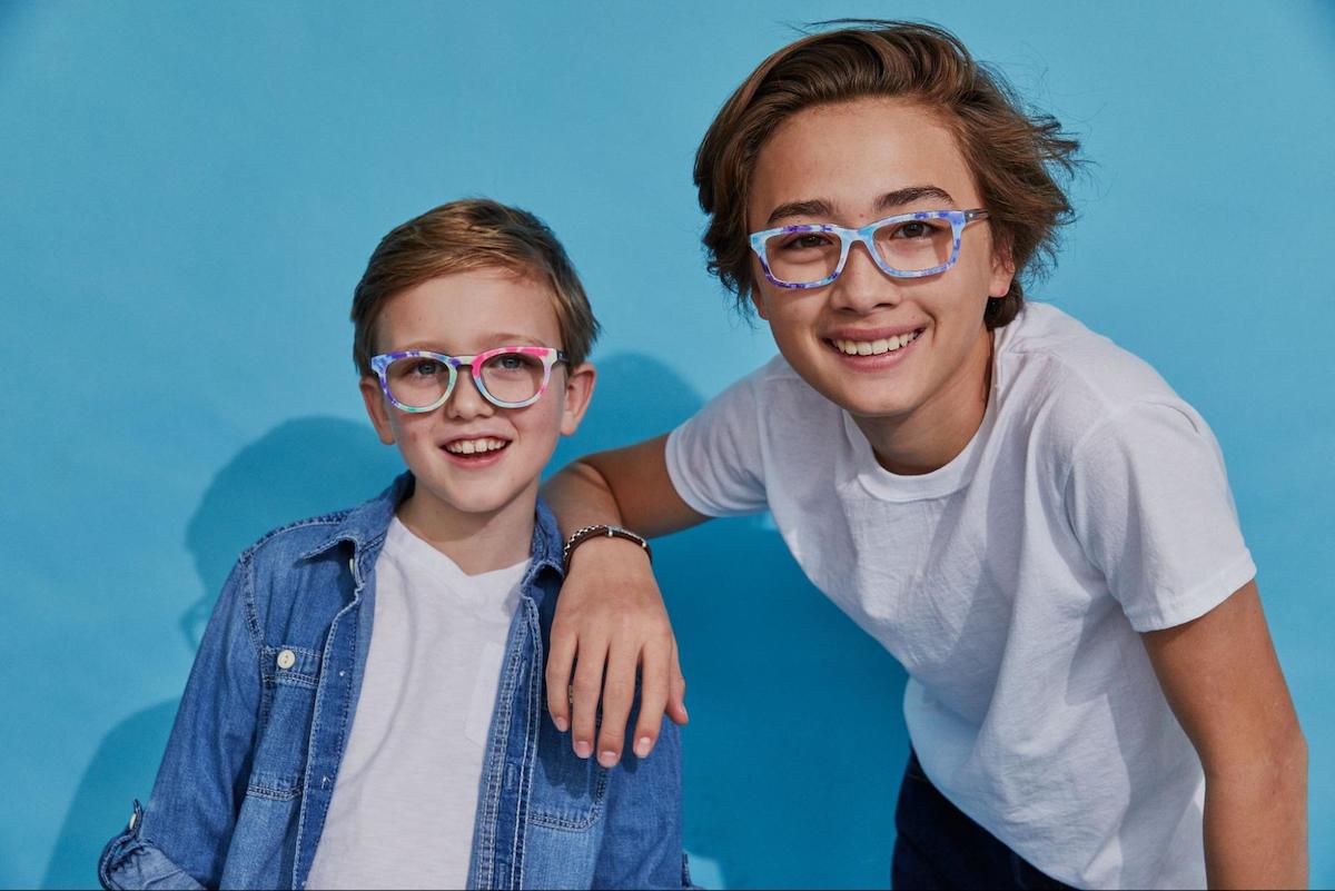 Blue light glasses for kids: siblings wearing eyeglasses