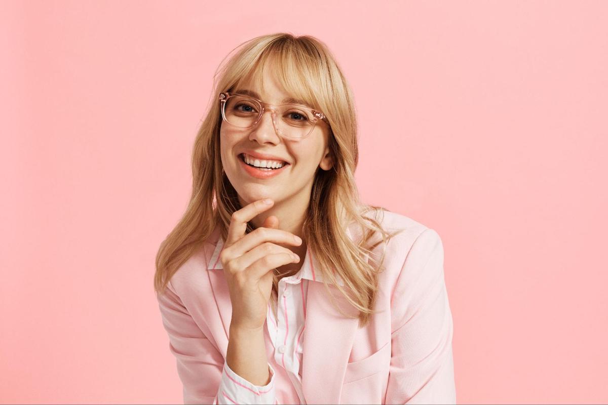 Glasses narrow face: woman smiling at the camera