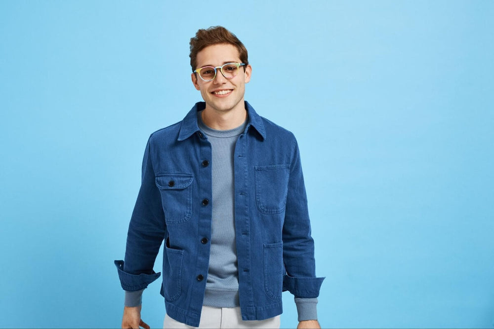 Circle glasses frames: man wearing a blue jacket