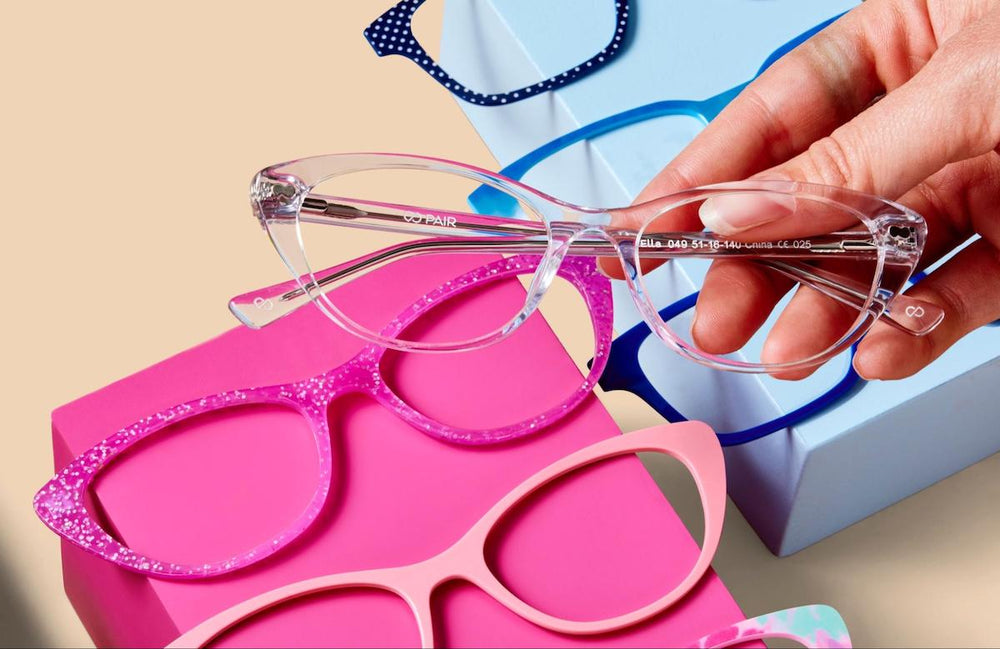 Glasses measurements: person holding Pair Eyewear's eyeglasses