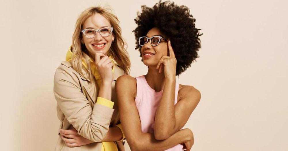 How to get used to progressive lenses: two women wearing glasses and posing at the camera