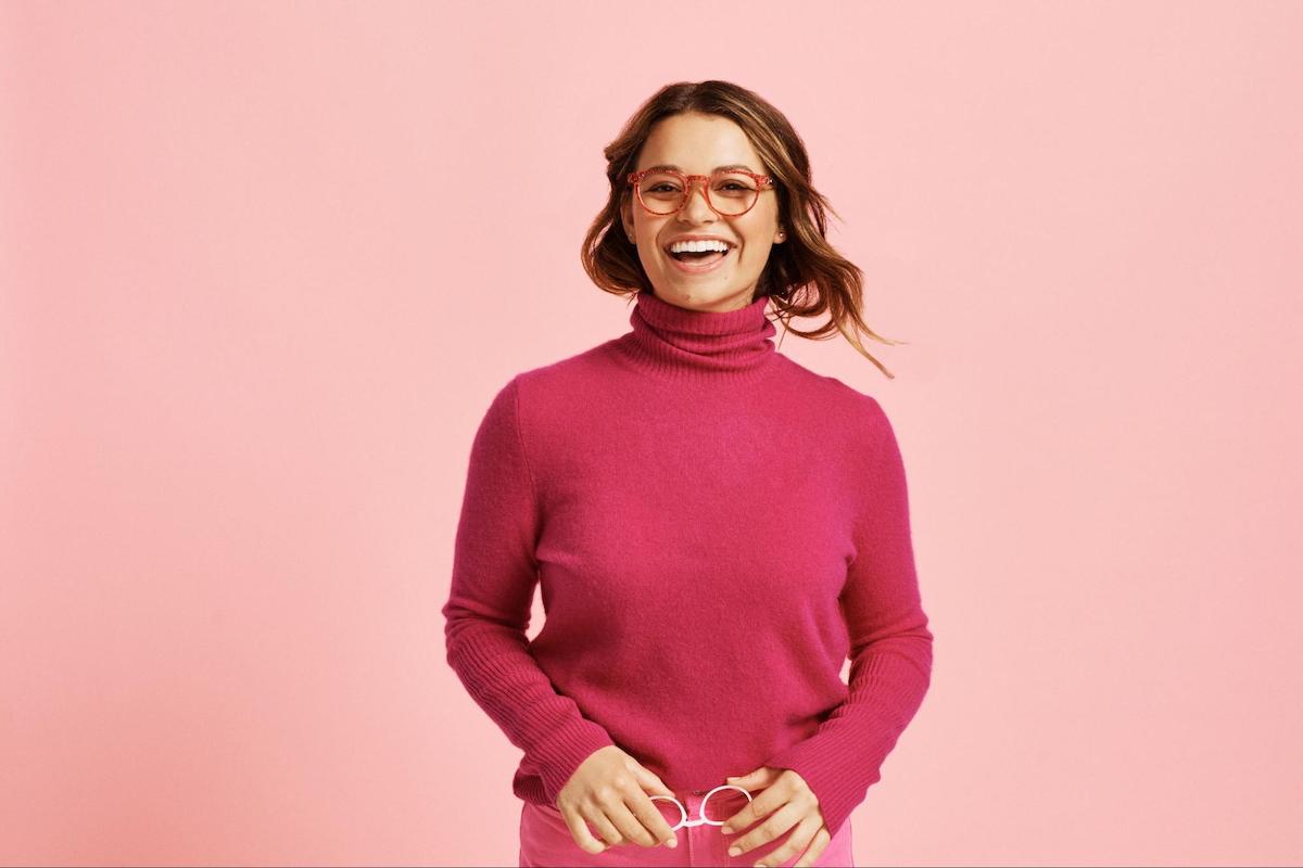 Glitter eyeglasses: woman smiling at the camera